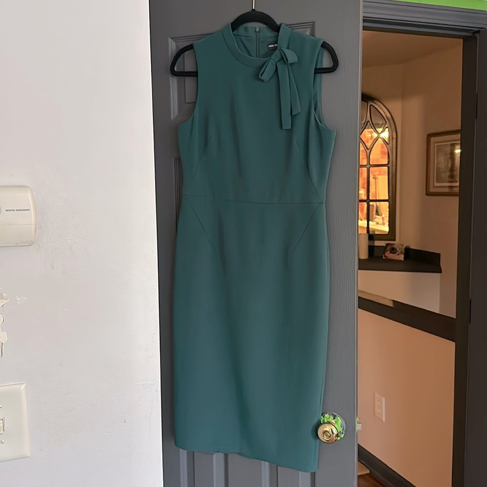 Maggy London, adorable machine washable green dress. Perfect for spring size 8.